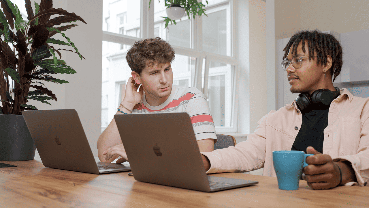two people having a meeting at a desk